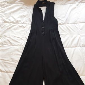 Black, open-back, wide-leg, jumper.